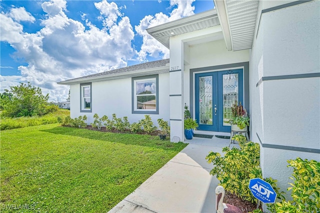 doorway to property with a yard