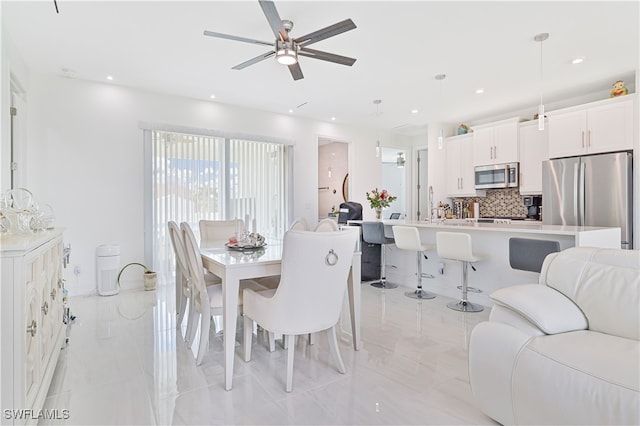 dining area with ceiling fan