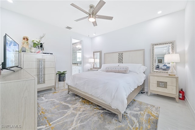 bedroom featuring connected bathroom and ceiling fan