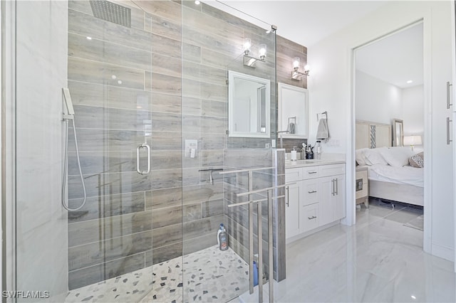 bathroom featuring tile walls, vanity, and a shower with shower door