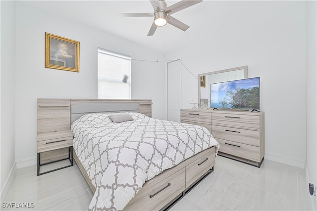 tiled bedroom with ceiling fan