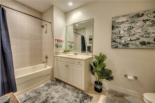 full bathroom with tile patterned flooring, shower / tub combo, vanity, and toilet