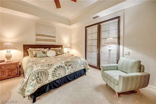 carpeted bedroom featuring crown molding and ceiling fan