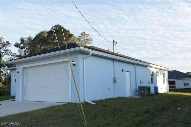 view of home's exterior with a lawn and central air condition unit