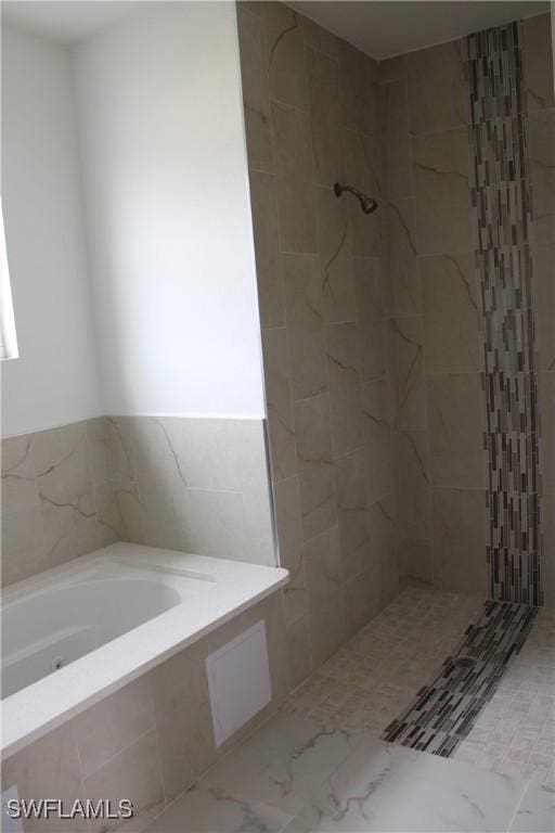 bathroom with separate shower and tub