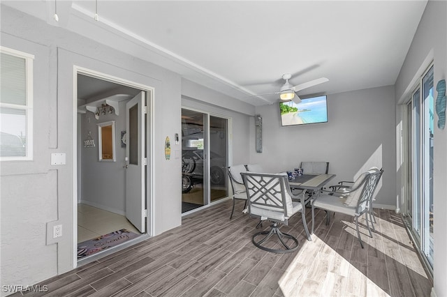 sunroom / solarium with ceiling fan and a wealth of natural light