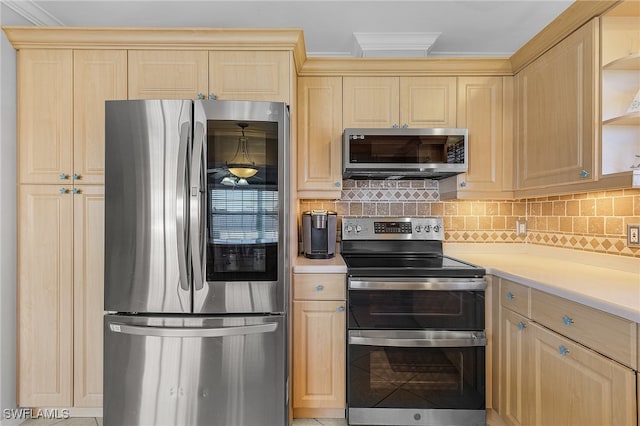 kitchen with crown molding, decorative backsplash, light brown cabinets, and stainless steel appliances