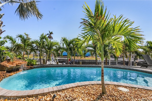 view of pool with pool water feature