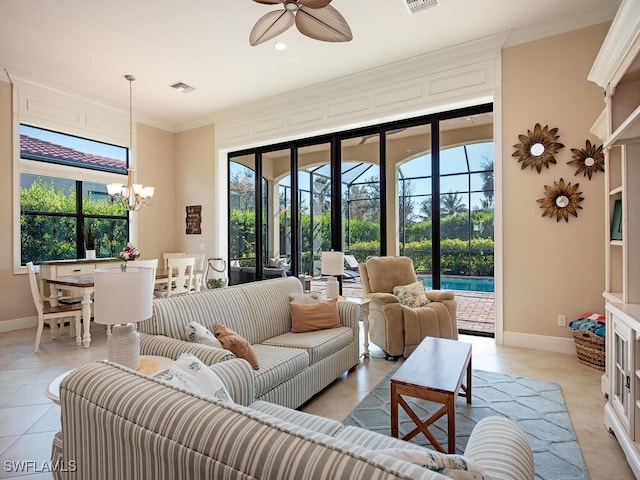 tiled living room with crown molding and ceiling fan with notable chandelier