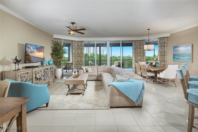 tiled living room featuring ceiling fan and ornamental molding