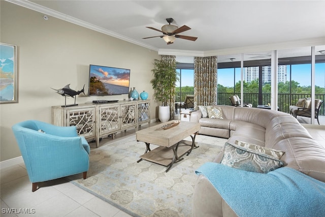 living room featuring ornamental molding, light tile patterned floors, and ceiling fan