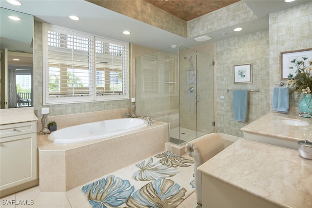 bathroom featuring separate shower and tub, tile patterned floors, and vanity