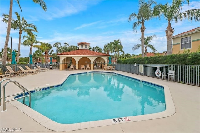 view of swimming pool featuring a patio area