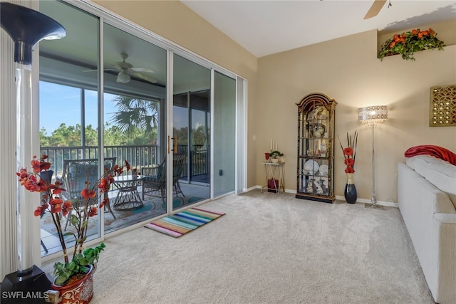 interior space featuring ceiling fan and carpet floors