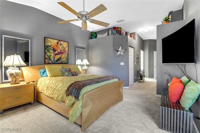 carpeted bedroom featuring ceiling fan and vaulted ceiling