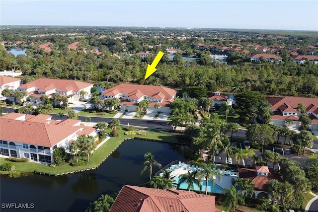 birds eye view of property featuring a water view