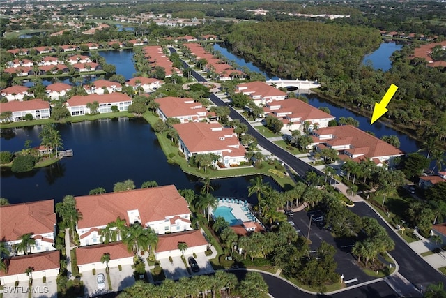 birds eye view of property featuring a water view