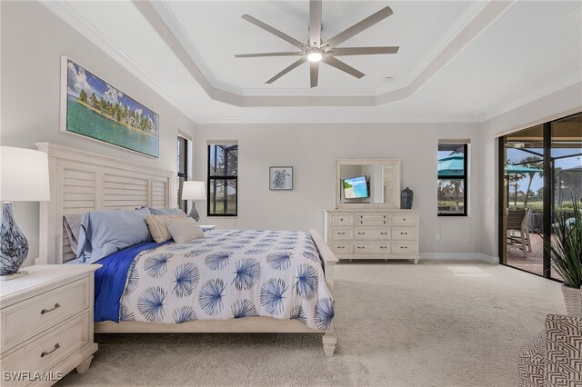 carpeted bedroom with access to outside, crown molding, a raised ceiling, and ceiling fan