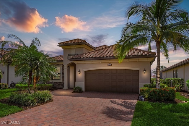 mediterranean / spanish-style house featuring a garage