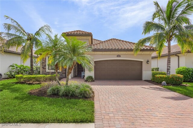 mediterranean / spanish-style home featuring a garage