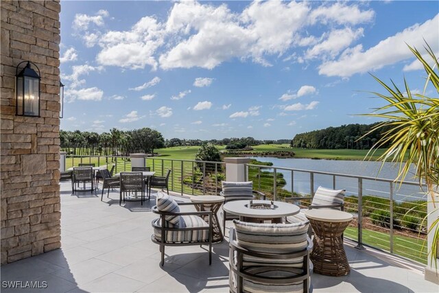 view of patio with a water view