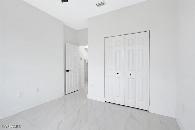 unfurnished bedroom with a closet