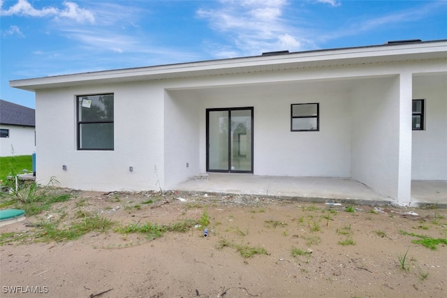 rear view of house with a patio