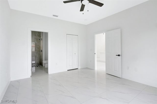 unfurnished bedroom featuring a closet, ensuite bathroom, and ceiling fan