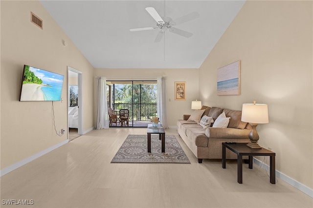 living room featuring ceiling fan, high vaulted ceiling, and light hardwood / wood-style floors