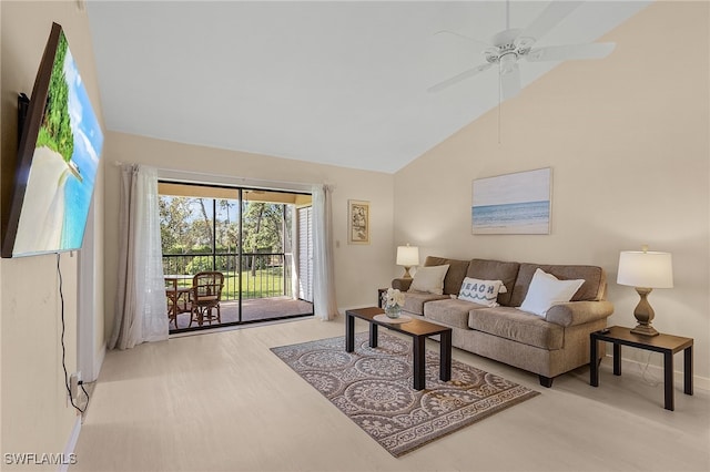 living room with ceiling fan, high vaulted ceiling, and light wood-type flooring