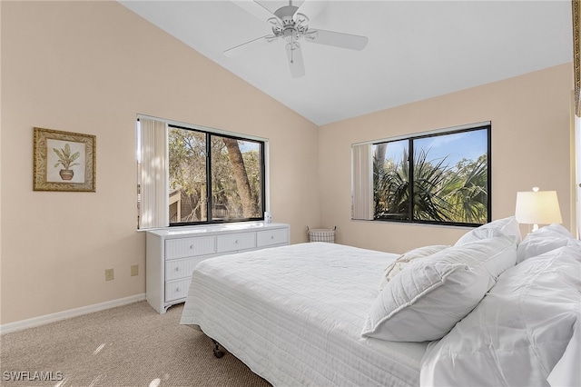 bedroom with ceiling fan, light carpet, and vaulted ceiling