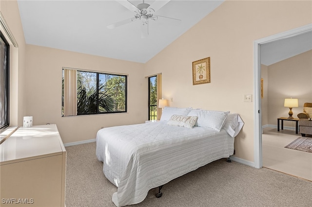 bedroom featuring ceiling fan, lofted ceiling, and light colored carpet