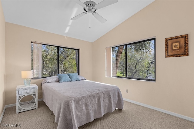 bedroom with ceiling fan, carpet flooring, lofted ceiling, and multiple windows