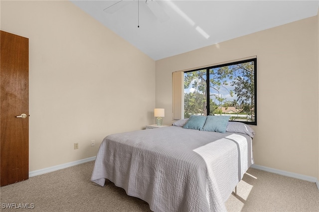 bedroom with light carpet, vaulted ceiling, and ceiling fan