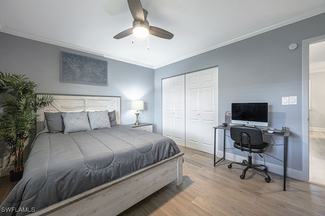 bedroom with crown molding, ceiling fan, a closet, and light hardwood / wood-style flooring