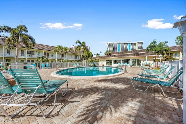 view of swimming pool featuring a patio