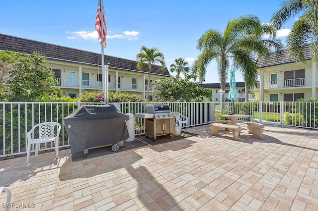 view of patio / terrace featuring area for grilling and a balcony