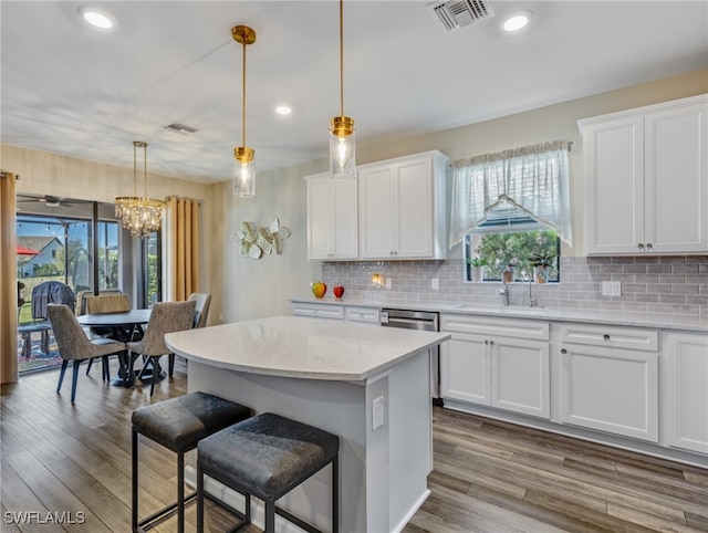 kitchen featuring plenty of natural light and white cabinets