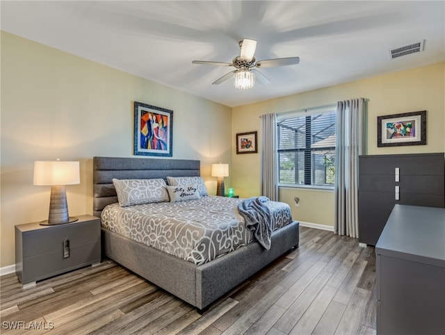 bedroom featuring ceiling fan and hardwood / wood-style floors