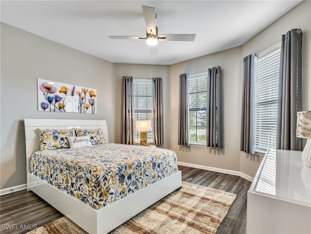 bedroom featuring dark hardwood / wood-style flooring and ceiling fan