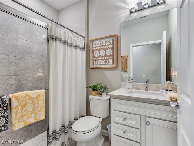 bathroom featuring walk in shower, vanity, and toilet