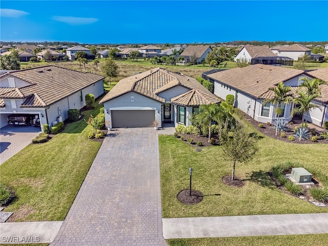 exterior space featuring a front yard and a garage