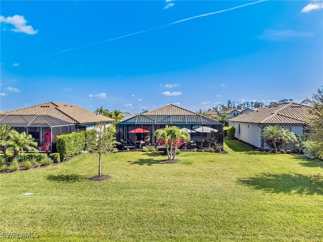 view of yard featuring glass enclosure