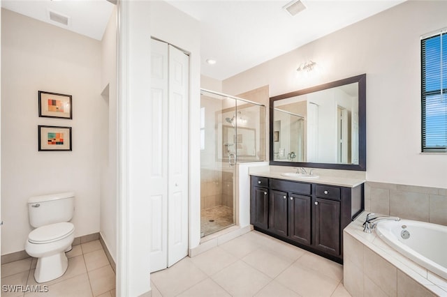 full bathroom with vanity, shower with separate bathtub, toilet, and tile patterned flooring