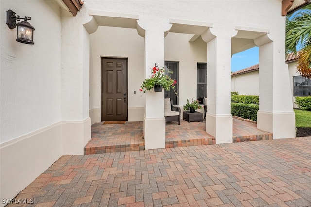 entrance to property featuring covered porch