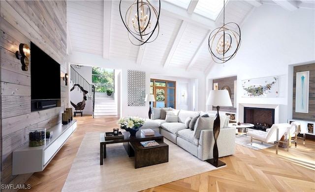 living room with high vaulted ceiling and an inviting chandelier