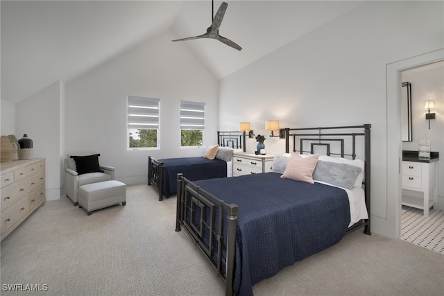 bedroom featuring light carpet, vaulted ceiling, and ceiling fan