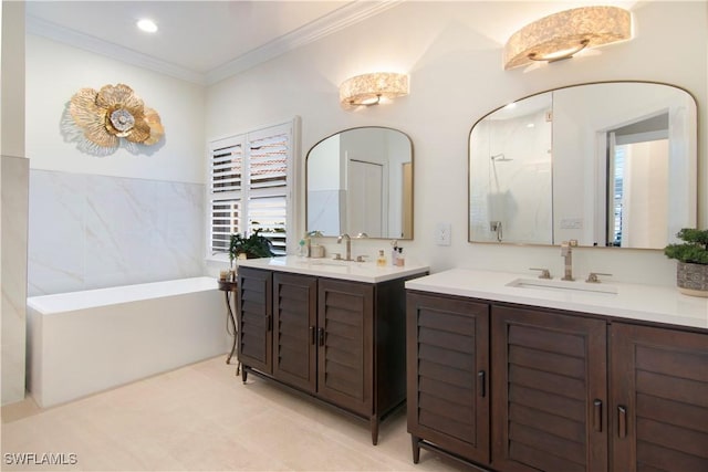 bathroom featuring a bathing tub, tile patterned floors, vanity, tile walls, and crown molding