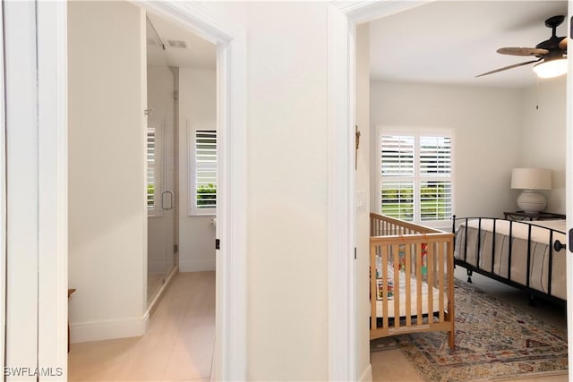 hall featuring light tile patterned flooring