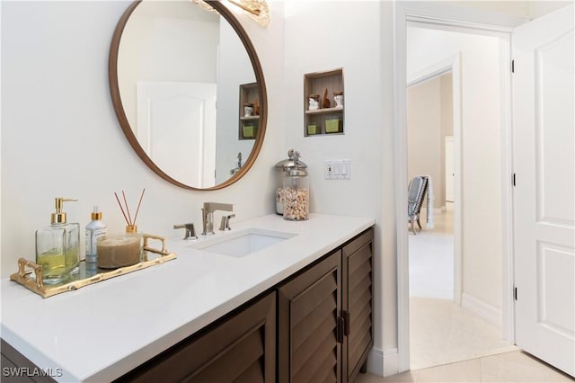 bathroom with tile patterned flooring and vanity